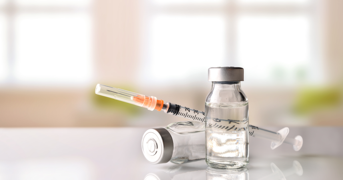 Vials and syringe for peptide therapy treatment on reflective surface in Ashburn, VA